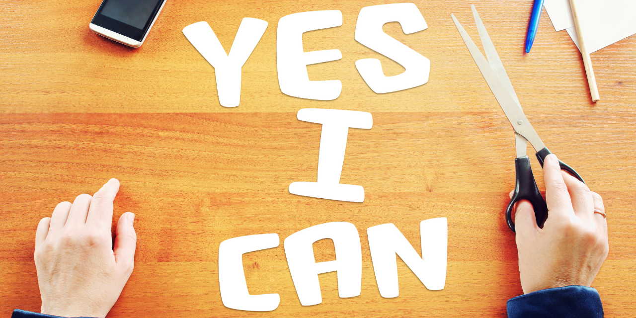The words "Yes I Can" cut out of paper