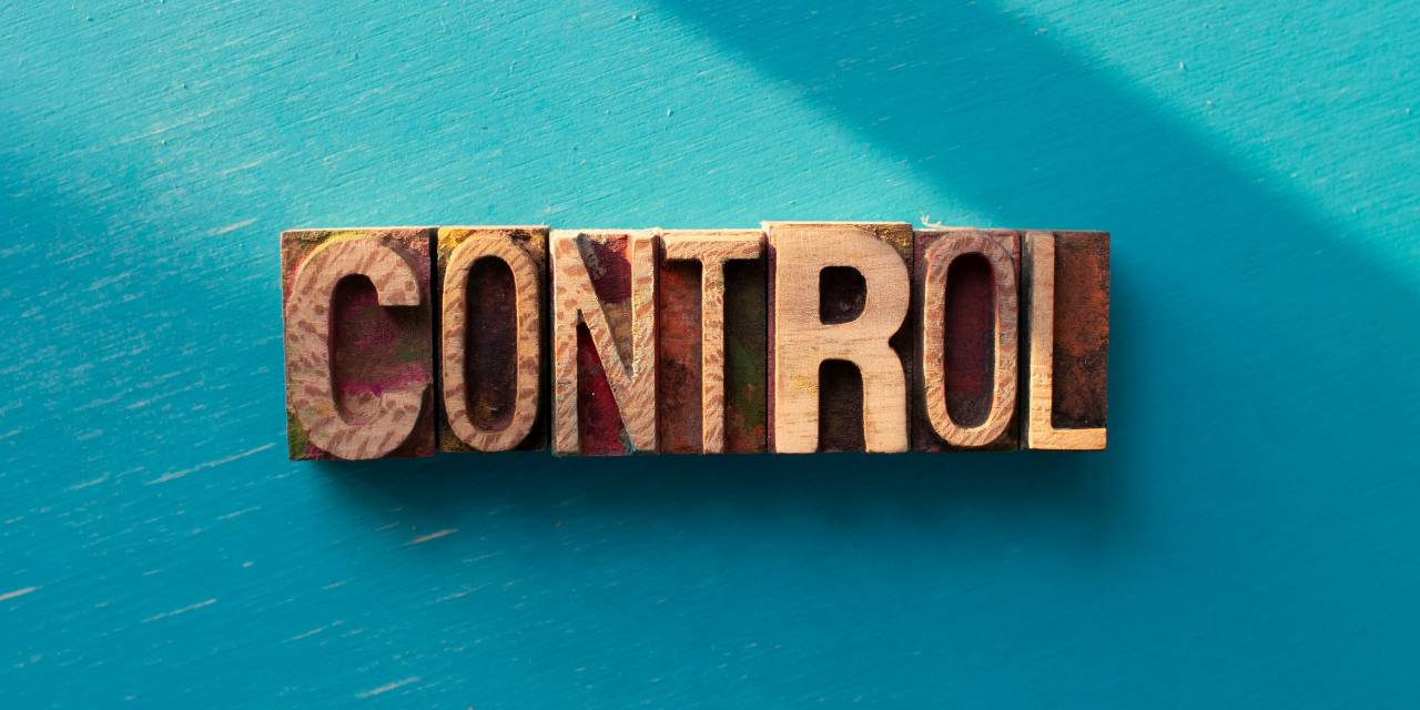 the word "control" in wooden letters