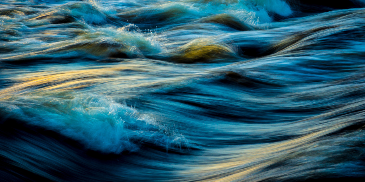 a zoomed in photo of some blue ocean waves