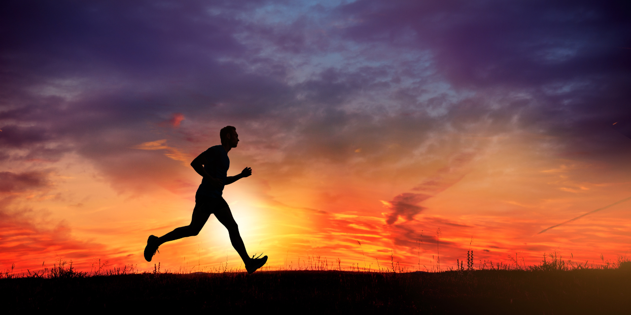 silhouette of running man at sunset